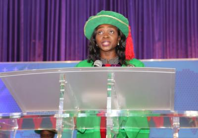 Dr Titilope  Dokunmu, reading the citation of the 26th Inaugural Lecturer, Professor Emeka E. Iweala