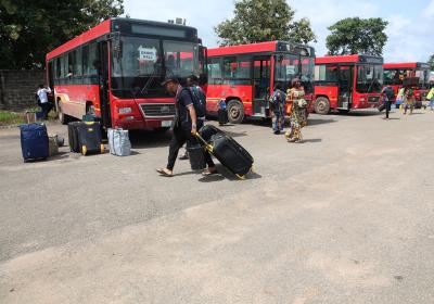 Other Students Making Their Way To The University Shuttle To Their Various Halls Of Residence