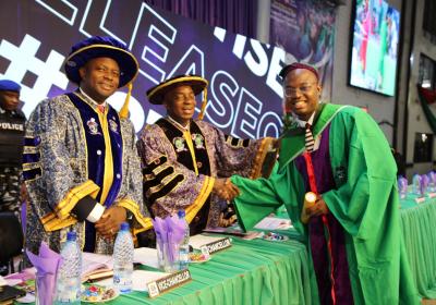 The Best Graduating Student Mr Nelson Elijah Ifechukwu Receiving A Warm Handshake From The Chancellor Dr David Oyedepo