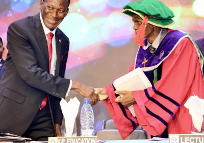 Dr. Adeniyi Beecroft Congratulating Professor Oluseyi Ajayi After He Delivered His Inaugural Lecture