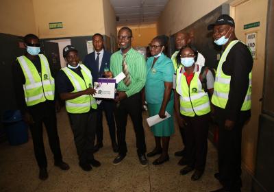 Professor Tayo George Presenting Some Covenant University Souvenirs To The Chief Medical Director Of Ota General Hospital Dr. Ore Philips