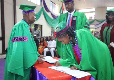 Representatives Of The Matriculating Students Signing The Register On Behalf Of Other Students